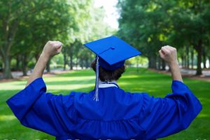 trade school graduate with fists in the air